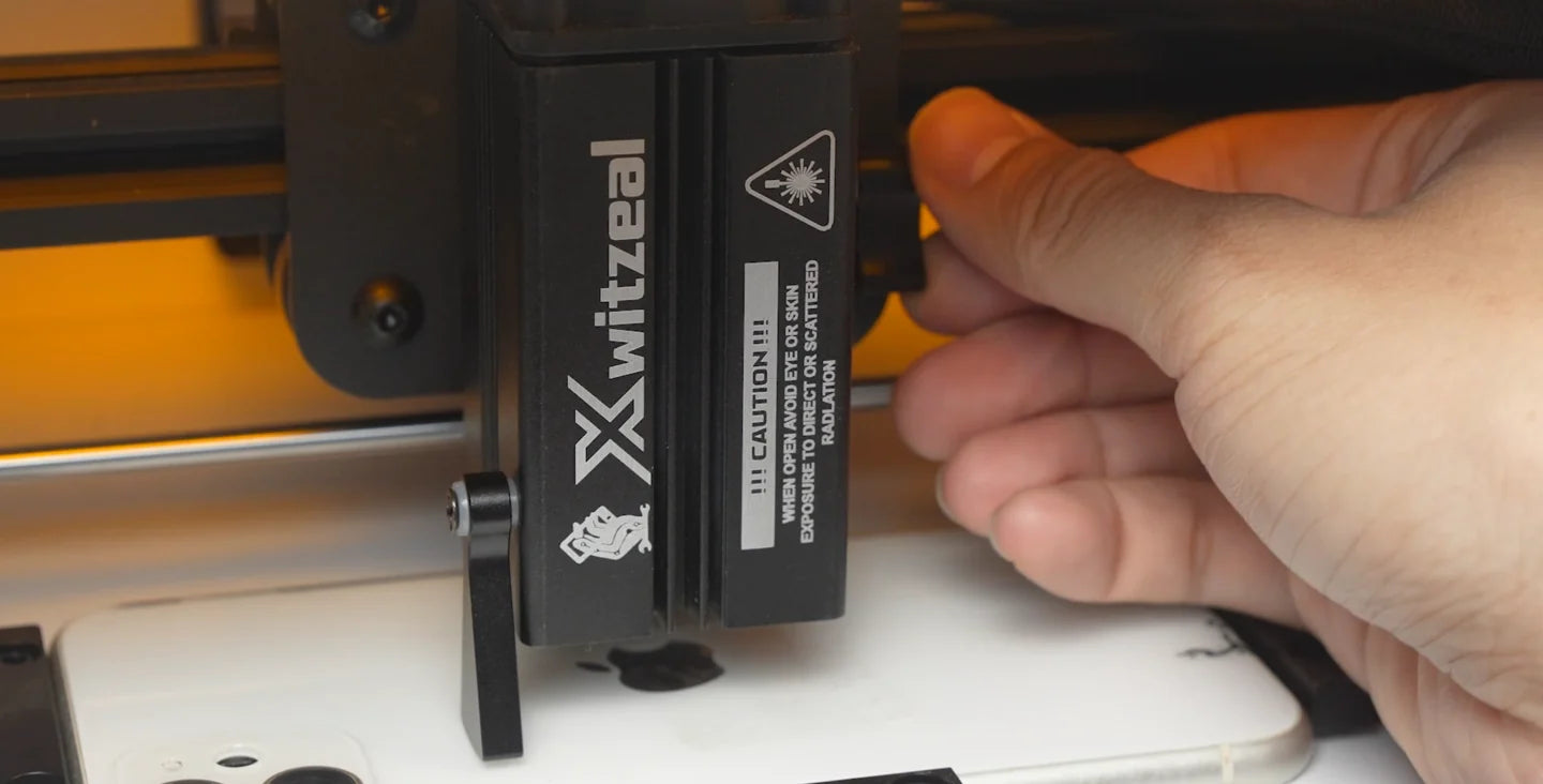Use the fold-down focus gauge to set the laser head height.